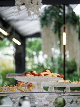 sandwiches, salty croissants and delicatessen finger food in a banqueting buffet