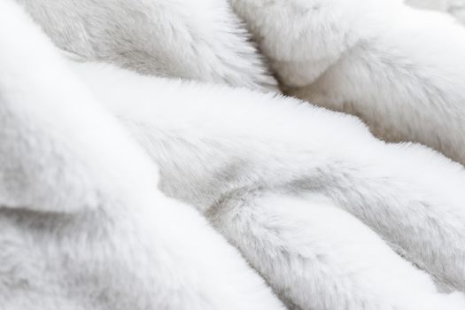 Luxury white fur coat texture background, artificial fabric detail
