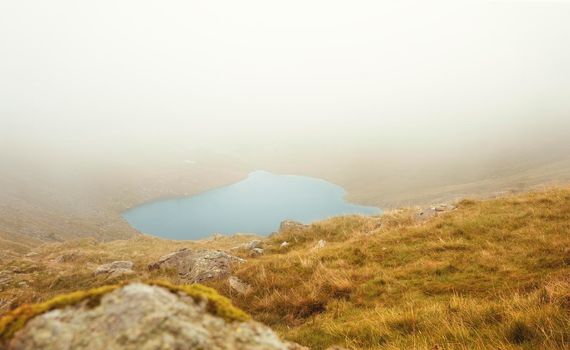 Amazing  view in the national park Lake District in England  on a foggy  day in Autumn