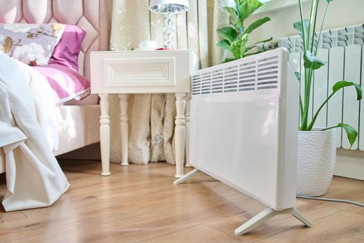 Electric heater in the interior of the bedroom