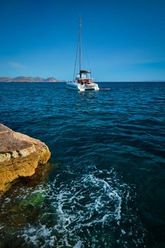 Yacht boat at Sarakiniko Beach in Aegean sea, Milos island , Greece