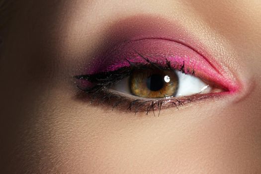 Closeup Macro of Woman Face with Pink Eyes Make-up. Fashion Celebrate Makeup. Beautiful Bright Magenta Red Make-up