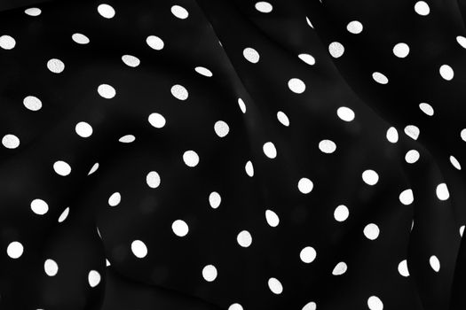 Vintage polka dot textile background texture, white dots on black luxury fabric design pattern