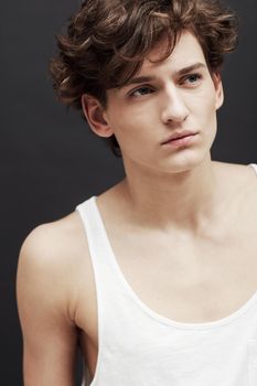 Pale and pensive. A handsome and fresh-faced young man looking away thoughtfully in studio.