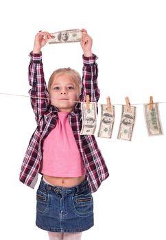 Girl with money. Girl hangs on the money on the rope on a white background