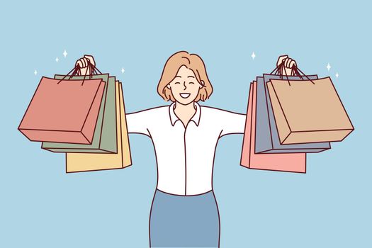 Smiling woman show bags after shopping