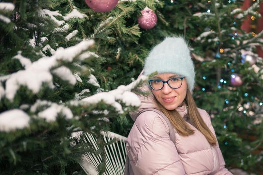 Pretty woman with fir tree