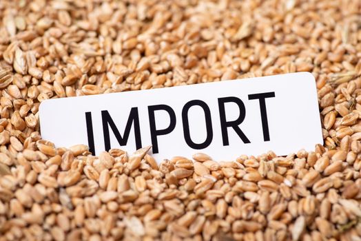 White paper with inscription Import on wheat