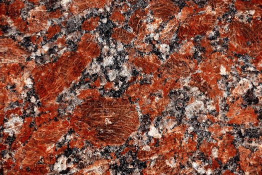 Nature granite texture background. Red granite tile texture close up. Polished decorative stone for photo design. Macro red grey granite decorative tile background may be used as a design pattern