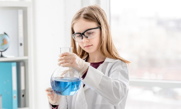 Girl on chemistry lesson