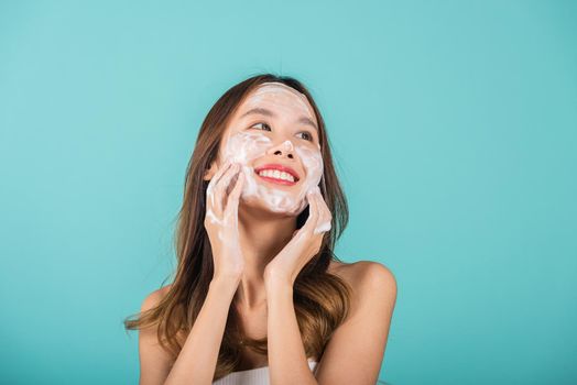 Asian woman face wash exfoliate scrub soap foam with skincare cleansing