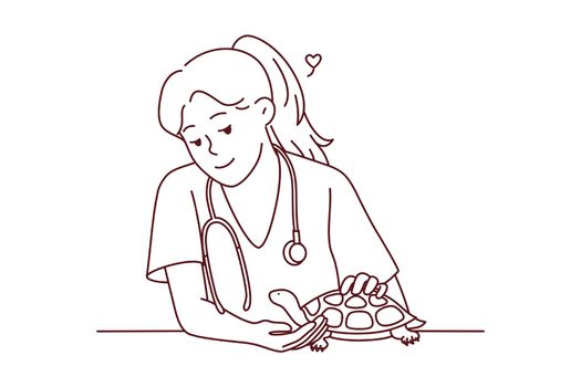 Female veterinarian take care of turtle