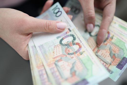 Women's hands count cash, rubles close-up