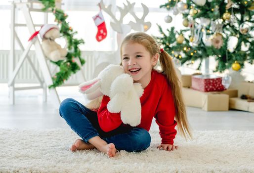 Child girl in Christmas time
