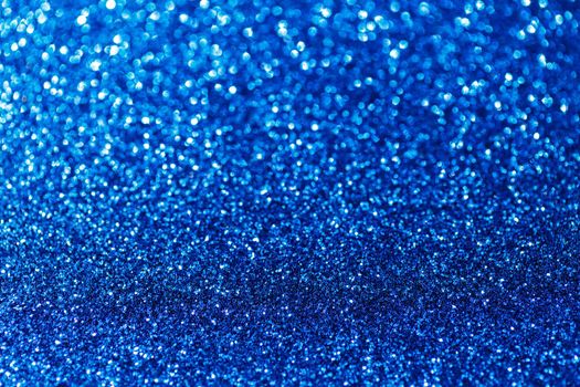 Blue glitter texture holidays background. Macro shot