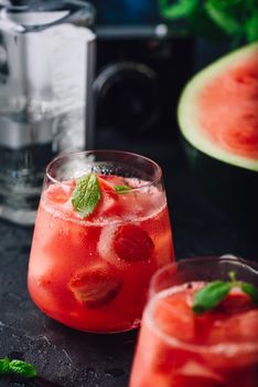 Watermelon and strawberry cocktail with mint garnish