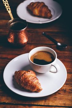 Turkish Coffee And Croissant on White Plate for Breakfast