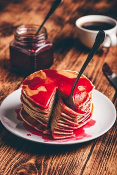 Stack of pancakes with berry fruit marmalade