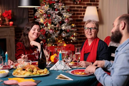 Woman and man celebrating christmas with parents