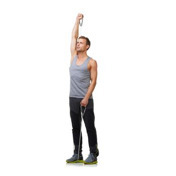 Muscle definition is his goal. A fit young man working out with a resistance band while isolated on a white background.