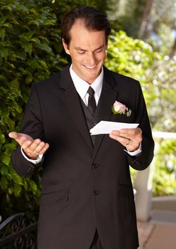 Preparing for his wedding vows. Handsome groom practicing his vows.