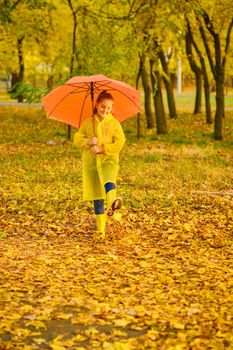 happy kid in autumn park