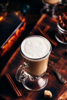 Coffee with Irish whiskey and whipped cream in glass