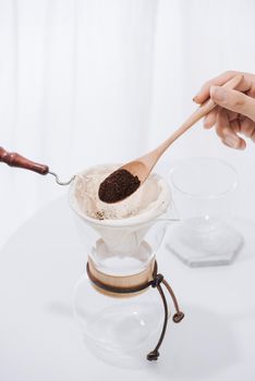 Man spills coffee powder to Drip Coffee