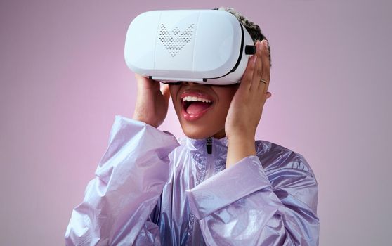 VR, 3d gaming and woman with surprise for futuristic digital game against pink mockup studio background. Metaverse tech, future and virtual reality for girl gamer with wow face at creative innovation