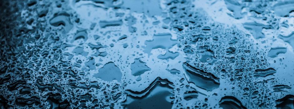 Water texture abstract background, aqua drops on blue glass as science macro element, rainy weather and nature surface art backdrop for environmental brand design