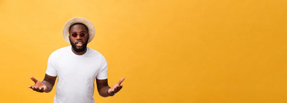 Young african american man wearing white t-shirt shouting and screaming loud to side with hand on mouth. Communication concept.