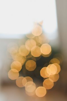 christmas background with christmas tree out of focus. abstract christmas background with defocused lights