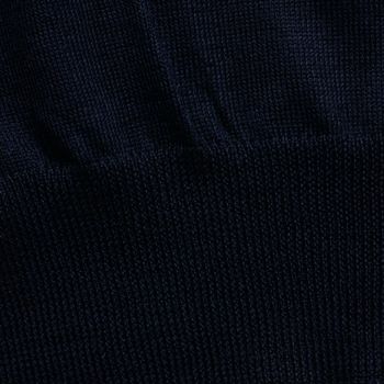 Knitted elastic band on navy wool sweater close up