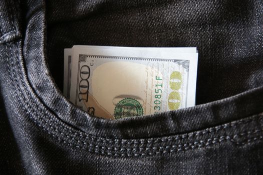 Money in jeans pocket. Profit concept.