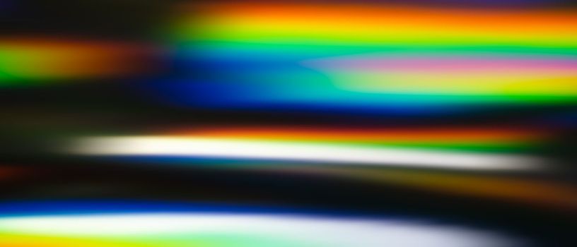 Holographic abstract background with colorful light rays moving fast horizontally. High quality photo