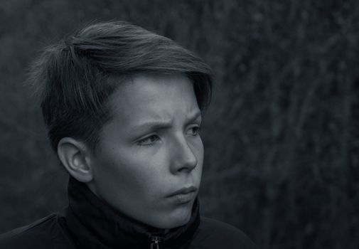 Black and white portrait of a teenager close up.