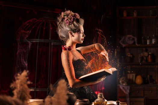 Charming woman witch use spell book