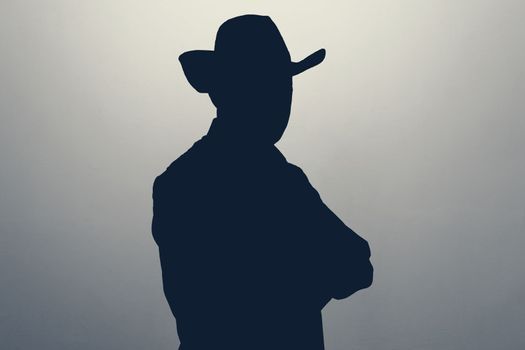 Unknown male person gray silhouette in studio. Anonymous or hidden secret.