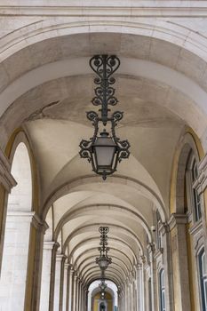Light vaulted corridor with hanging lamps of Ribeira Palace