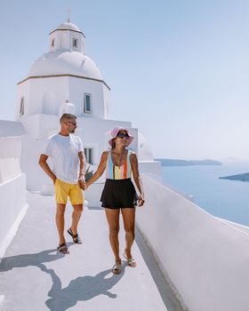 Santorini Greece, young couple on luxury vacation at the Island of Santorini