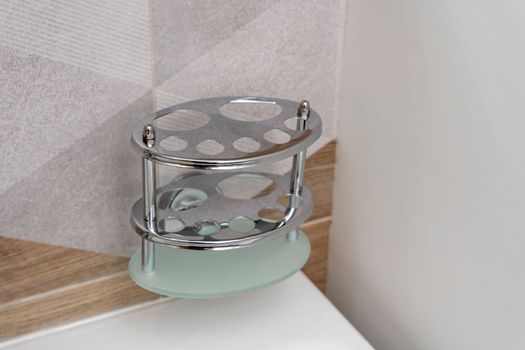 shiny toothbrush holder in the bathroom interior. bathroom accessories
