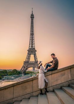 couple men an woman honeymoon Paris Eiffel tower sunrise, couple men and woman city trip in Paris
