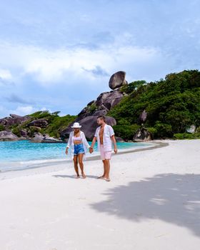 Couple walking on the beach at the tropical Similan Islands in Southern Thailand