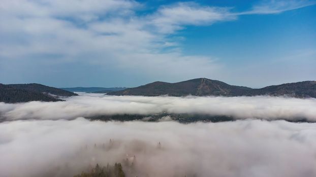 Fog in the mountains. Aerial photography. View of foggy mountains. download image