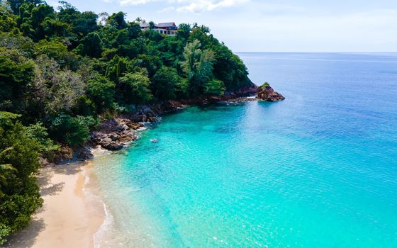Drone aerial view at Banana beach with palm trees in Phuket Thailand