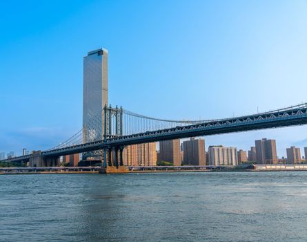 Blue sky over the Manhattan bridge early morning New York