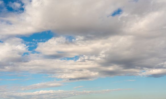 Heap clouds against the azure sky as a background for presentations