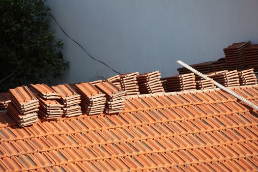 Construction Worker Tile Roofing Repair sunny day