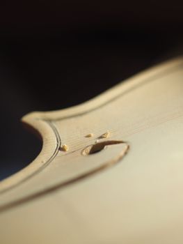 luthier cutting and shaping violin f - hole