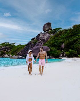 Couple walking on the beach at the tropical Similan Islands in Southern Thailand